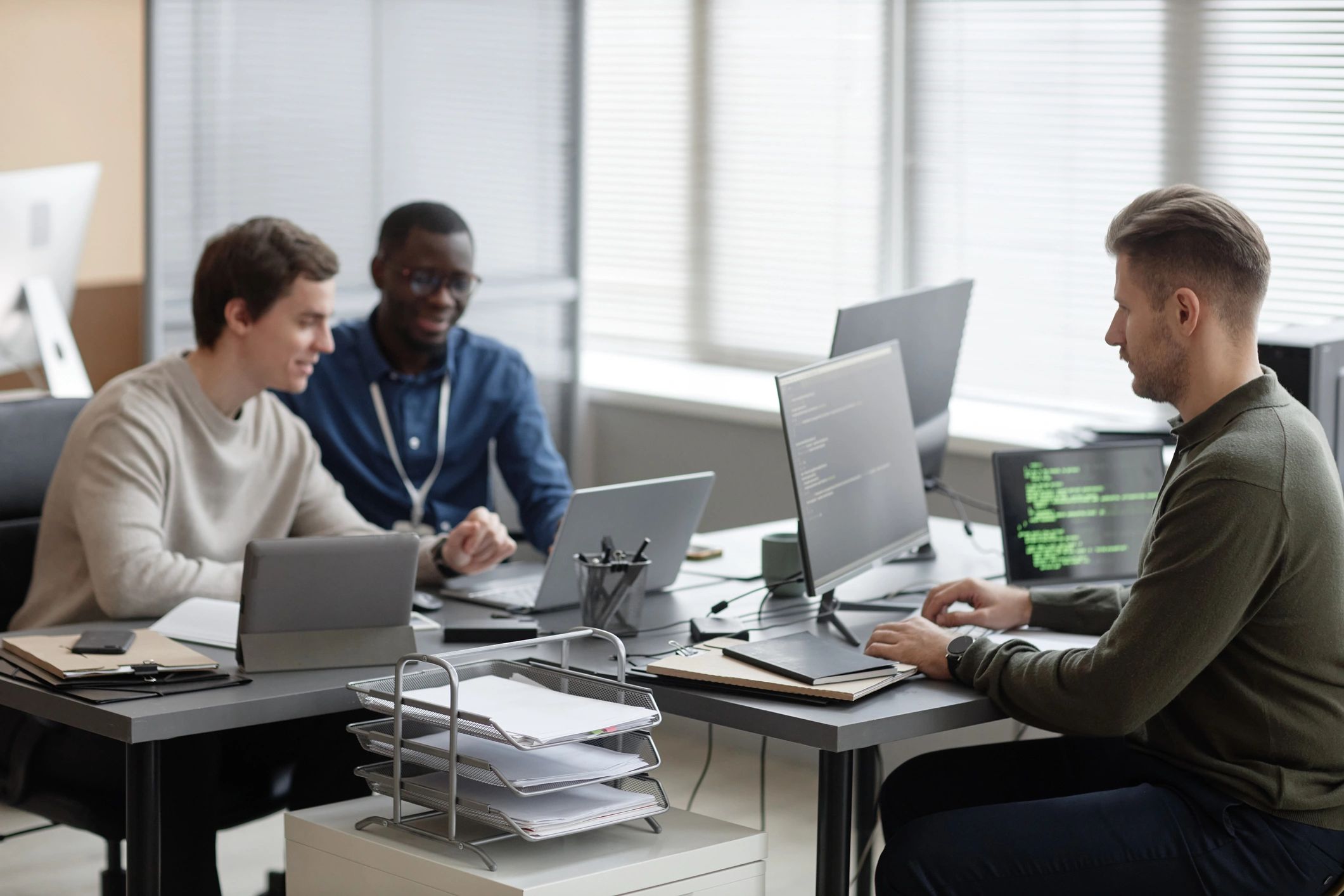 Cybersecurity professionals working together in a security operations office
