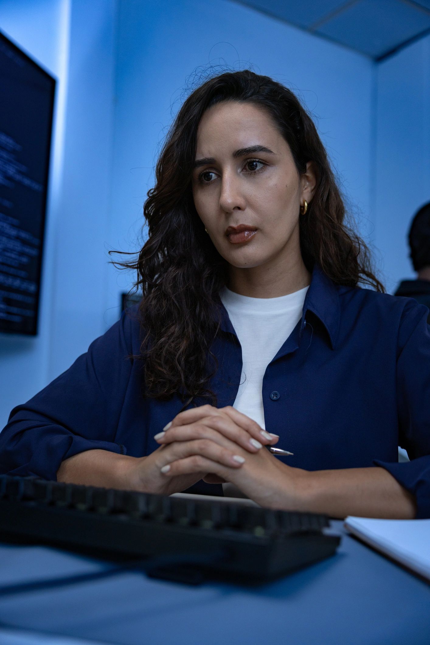 Cybersecurity professional working at computer