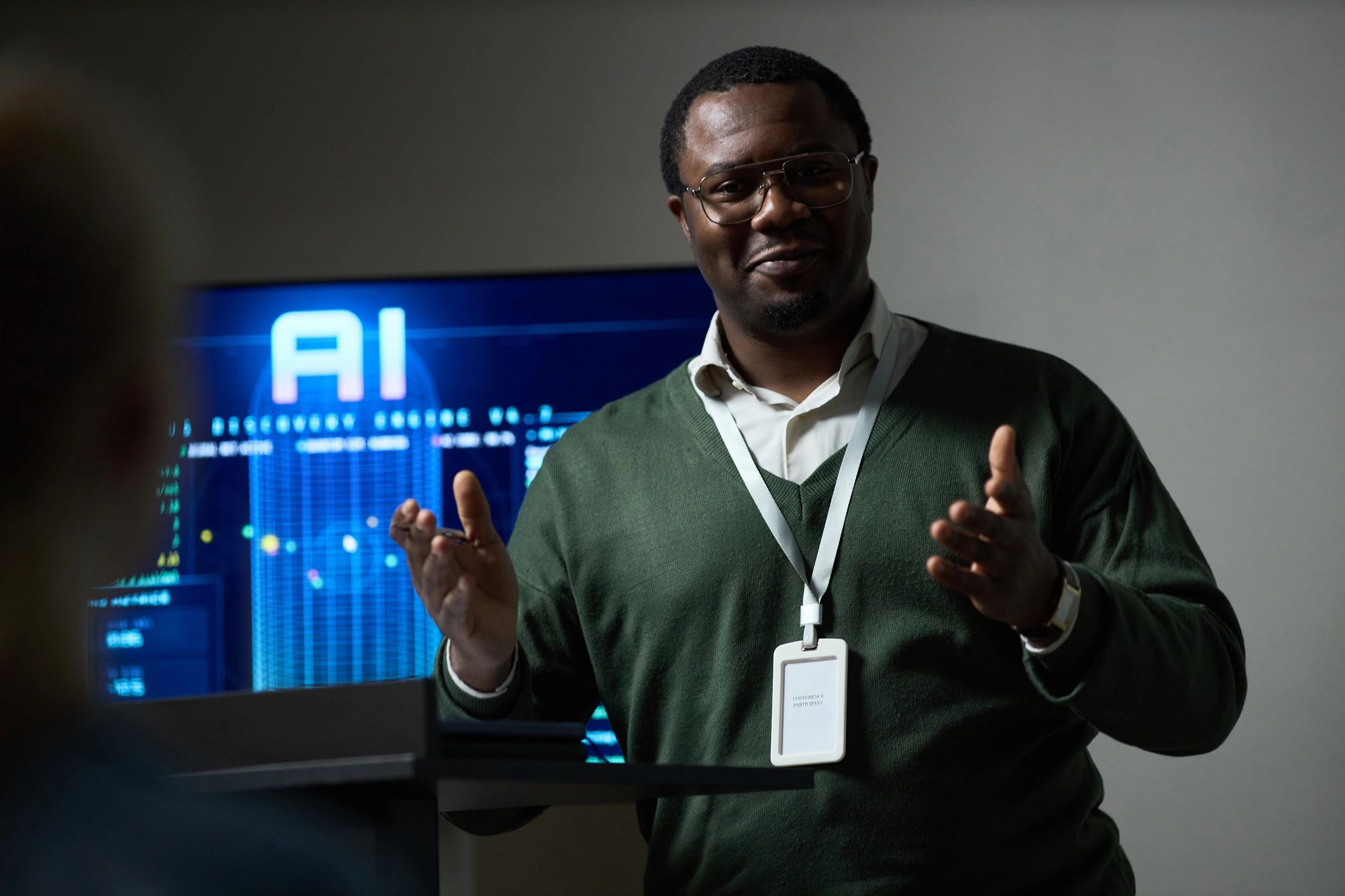 Business presenter discussing AI strategy and cyber resilience